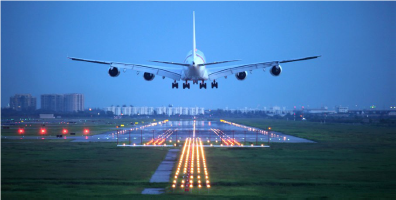 Boeing 747 landing on a runway as seen from behind